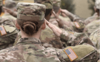 People in military clothing saluting