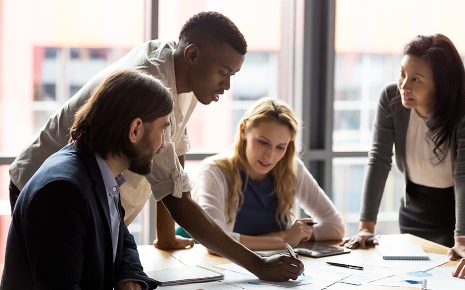 A group of recruiters review a list of what students are looking for in a job.