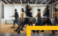 People walking in an office.