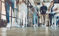People walking in an office.