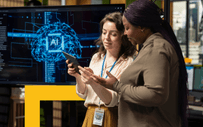 Two career services professionals review a report.