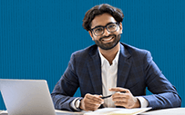 A happy recruiter working at his desk.