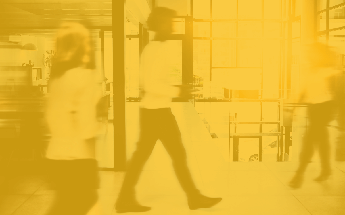 Someone walks through an office.