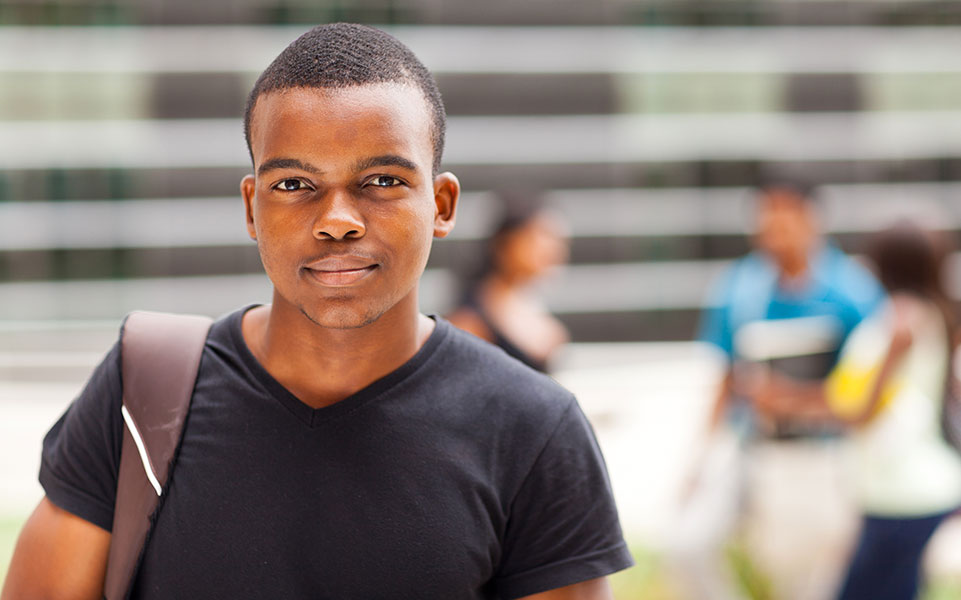 A black, male student on campus.