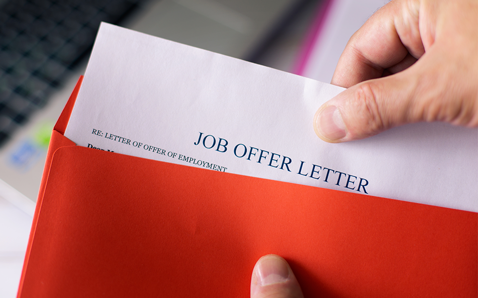 A job offer letter in an envelope.